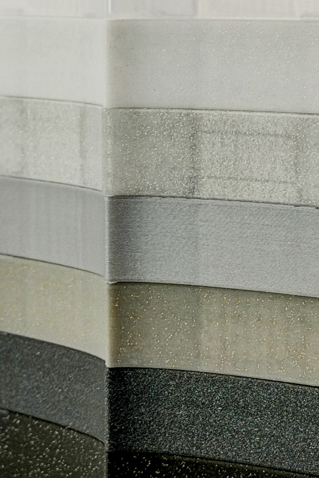 A stack of Reading Rays in silver and charcoal colors.